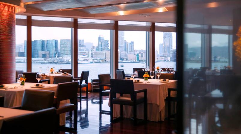 The Lung King Heen dining room has a fine Victoria Harbour daytime view.