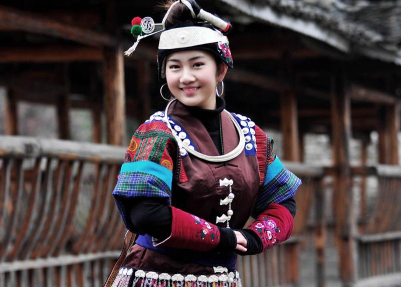 The miao girls dress up in their best traditional costume and silver headdresses in the Lusheng Festival.
